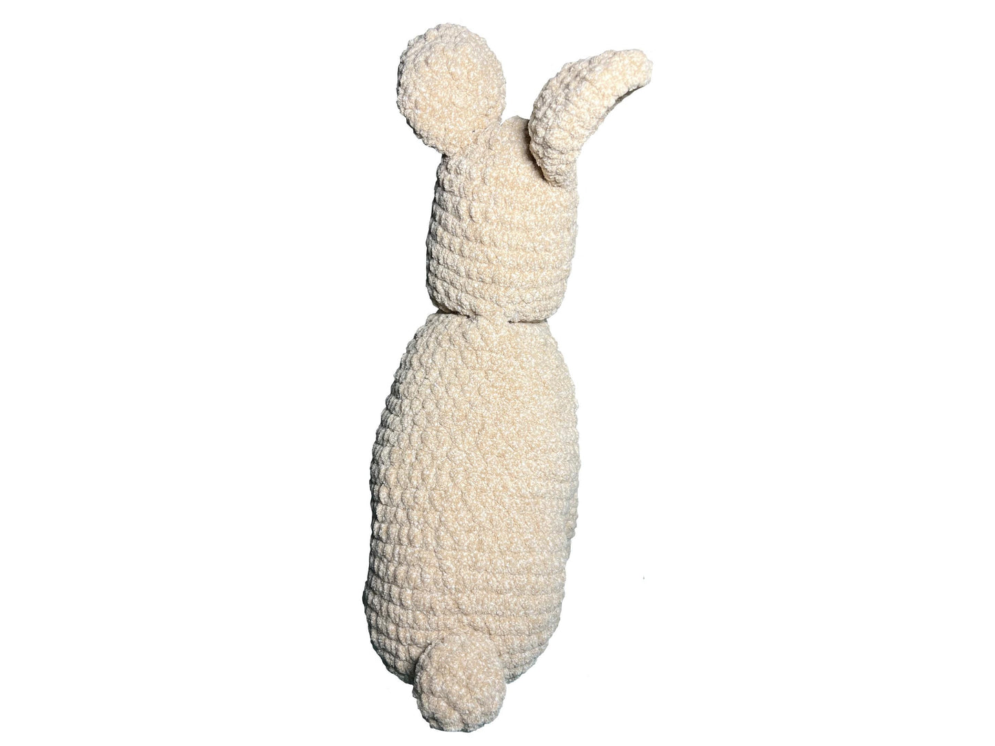 Crocheted bunny toy on a white background