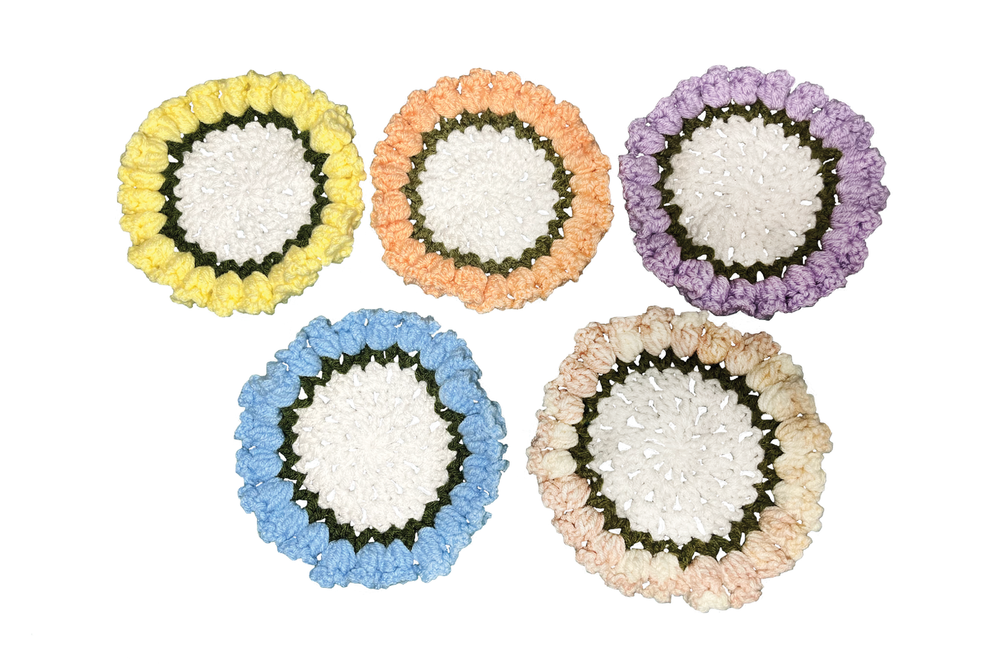 Set of five colorful round crocheted coasters on a white background