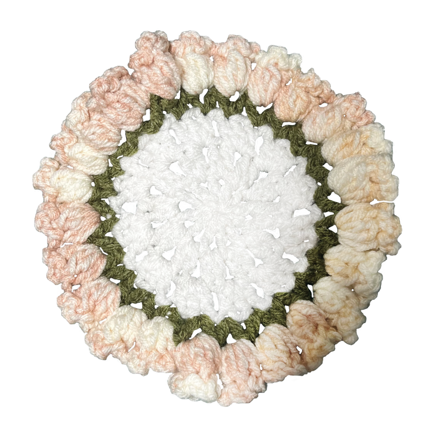 Round crochet coaster with a white center and pink on a white background